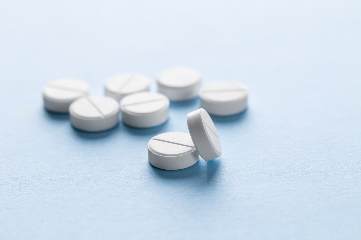 trazodone tablets on a light blue background